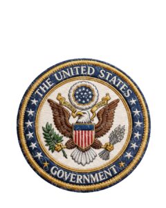 Embroidered round patch of the United States government seal with an eagle, shield, olive branch and arrows and a blue border with stars.